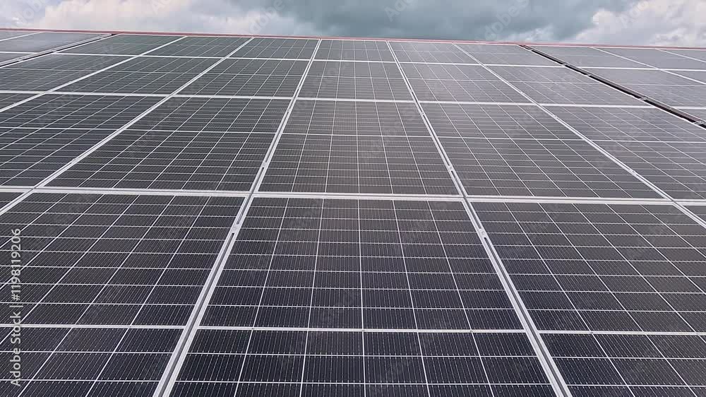 Vast Solar Panel Installation Covering the Metal Roof of a Large Industrial Facility Vast Solar Panel Installation Covering the Metal Roof of a Large Industrial Facility