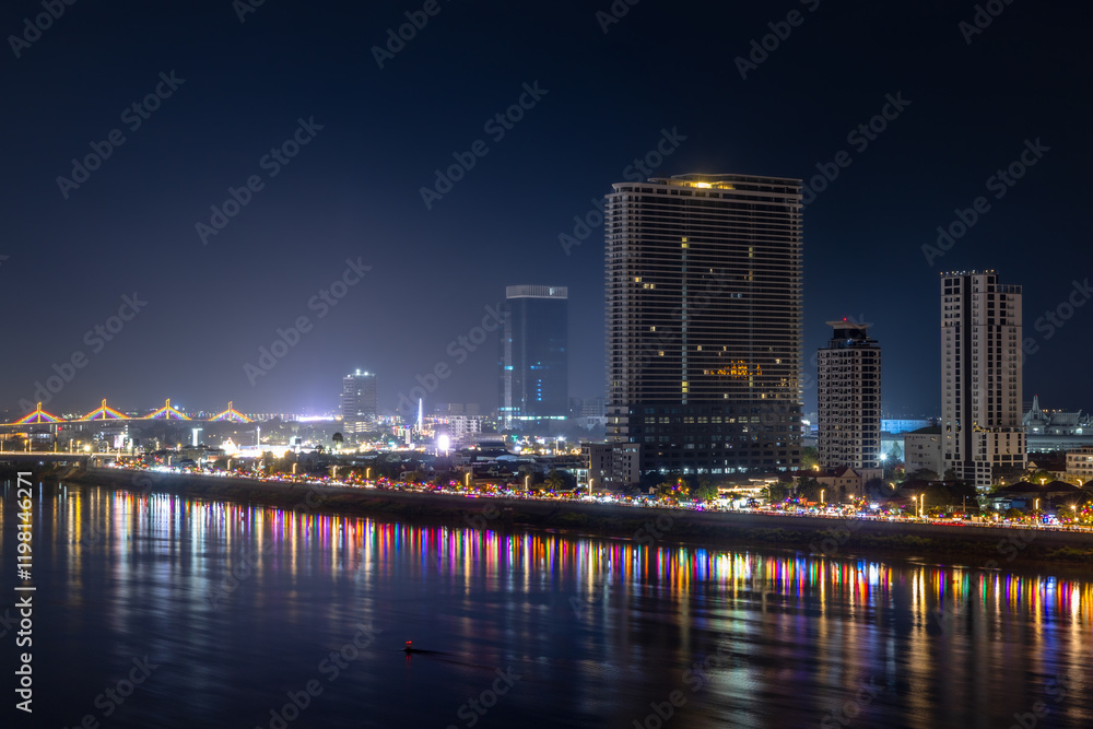 Tonle Sap river bank with modern buildings and residential areas district night panorama, Phnom Penh city panorama, Cambodia Tonle Sap river bank with modern buildings and residential areas district night panorama, Phnom Penh city panorama, Cambodia