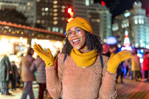 Excited tourist enjoying christmas market at night in moscow photo