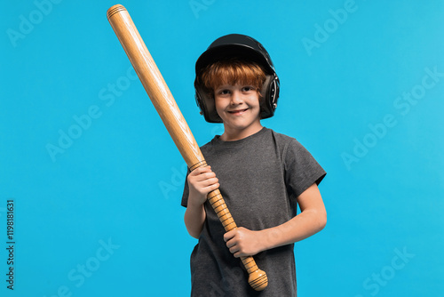 Photography Little boy in helmet with baseball bat on light blue background