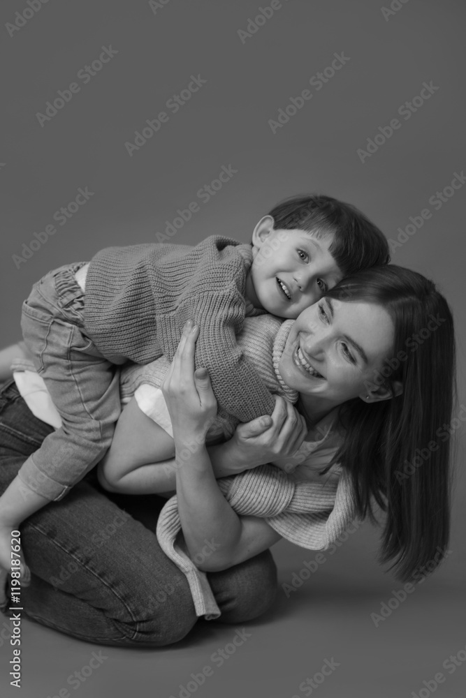 Happy mother with her little son, black and white effect Happy mother with her little son, black and white effect