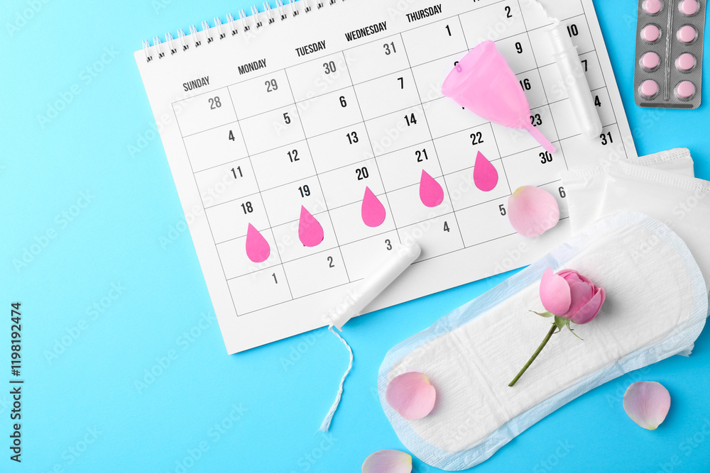 Fototapeta premium Flat lay composition with calendar and menstrual products on light blue background