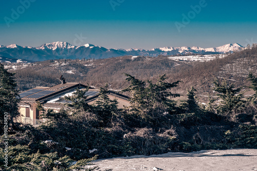 The main ridge of the Apennines: from Monte Cimone to Monte Corno alle Scale seen from the village of Monghidoro, Metropolitan City of Bologna, Emilia-Romagna, Italy photo