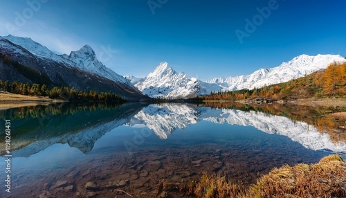 Wallpaper Mural Majestic snow-capped mountains reflected in a crystal-clear lake. Torontodigital.ca