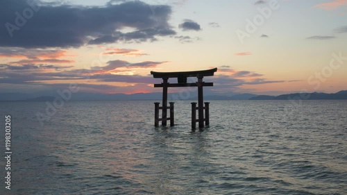 Morning view of Shirahige shrine torii gate from lake Biwa, Japan