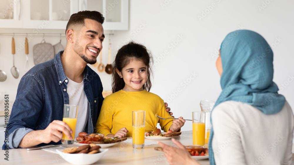Lunch At Home. Young Muslim Family Of Three Sitting At Table In Kitchen And Eating Tasty Food, Cheerful Middle Eastern Parents And Their Little Daughter Enjoying Spending Time Together, Closeup Lunch At Home. Young Muslim Family Of Three Sitting At Table In Kitchen And Eating Tasty Food, Cheerful Middle Eastern Parents And Their Little Daughter Enjoying Spending Time Together, Closeup