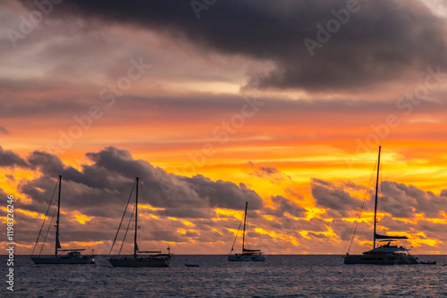 French Polynesia, Rangiroa Atoll. Sailboats at sunset. photo