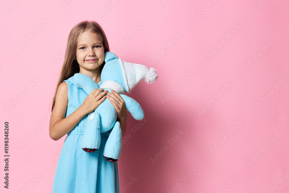 Adorable little girl in a blue dress holding a teddy bear on a vibrant pink background, radiating innocence and joy Adorable little girl in a blue dress holding a teddy bear on a vibrant pink background, radiating innocence and joy