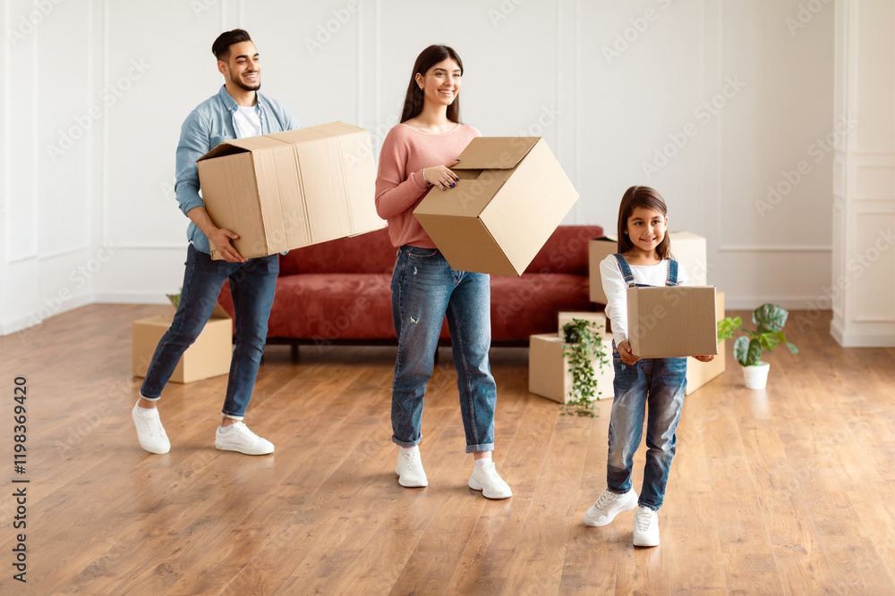 Happy loving family of three carrying cardboard boxes together, helping each other in their new home on moving day. Young tenants relocating to new apartment with belongings, unpacking in living room Happy loving family of three carrying cardboard boxes together, helping each other in their new home on moving day. Young tenants relocating to new apartment with belongings, unpacking in living room