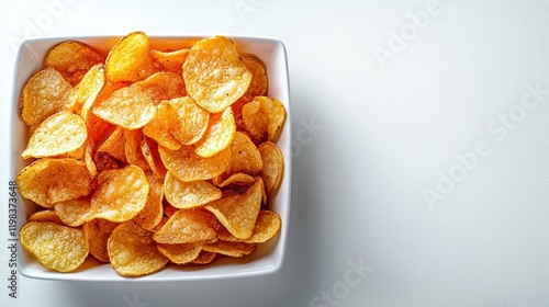 Crispy potato chips bowl, white background. photo