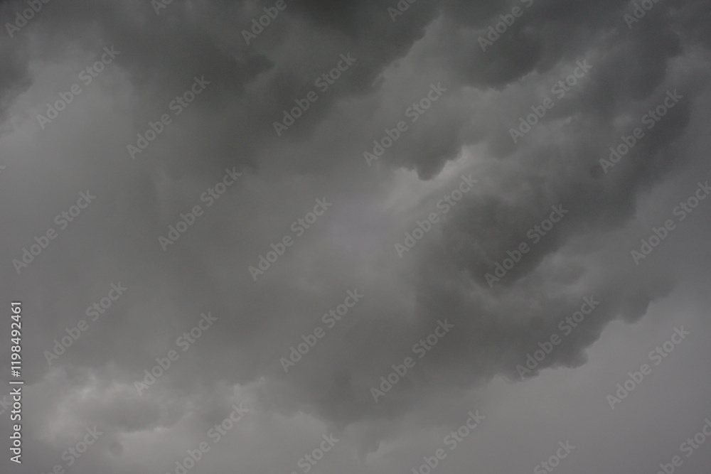 The dark sky with heavy clouds converging and a violent storm before the rain.Bad or moody weather sky and environment. carbon dioxide emissions, greenhouse effect, global warming, climate change. The dark sky with heavy clouds converging and a violent storm before the rain.Bad or moody weather sky and environment. carbon dioxide emissions, greenhouse effect, global warming, climate change.