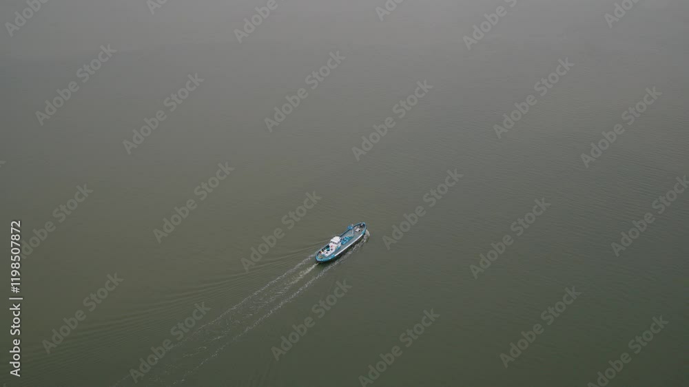 Small vessel moving in endless water, aerial view Small vessel moving in endless water, aerial view