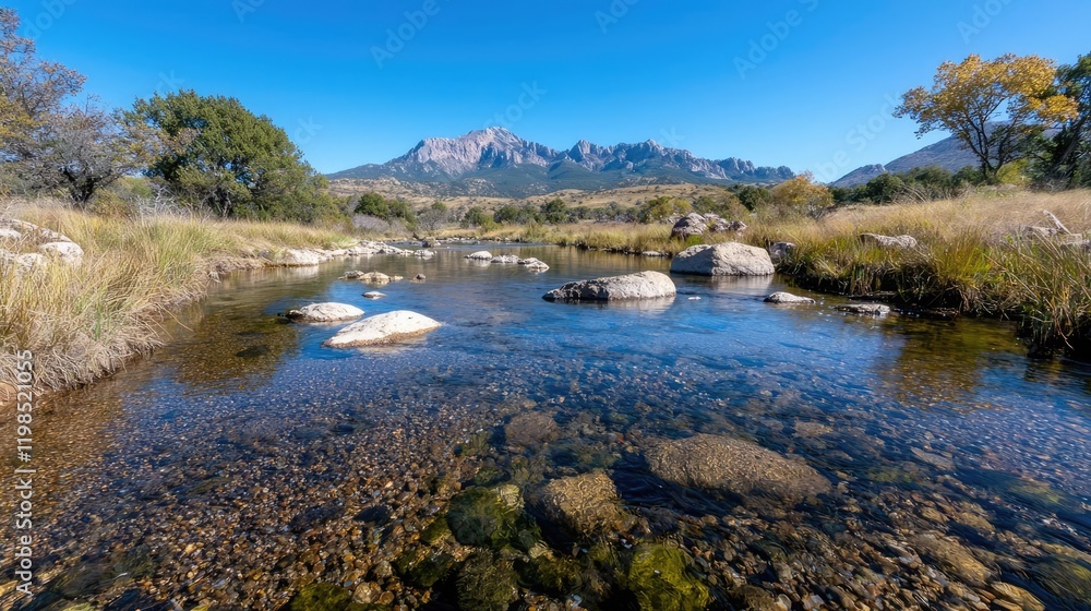 Obraz premium Calm river flows through desert landscape, mountains backdrop, clear water. Use Travel brochure