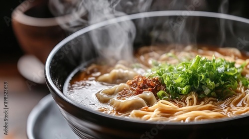 Steaming Bowl of Delicious Asian Noodle Soup with Dumplings