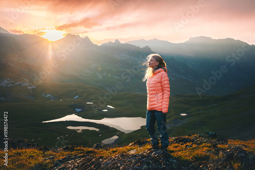 Quadro em tela Woman enjoying sunset view in mountains travel solo, girl hiking adventure activ
