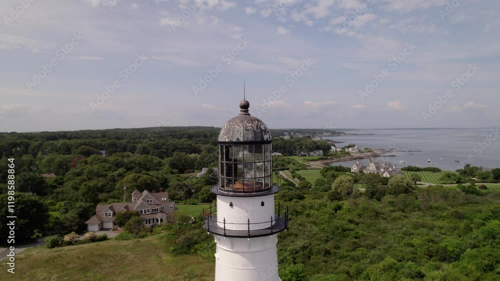 Historic lighthouse with ocean and coastal homes in Cape Elizabeth, Maine Historic lighthouse with ocean and coastal homes in Cape Elizabeth, Maine