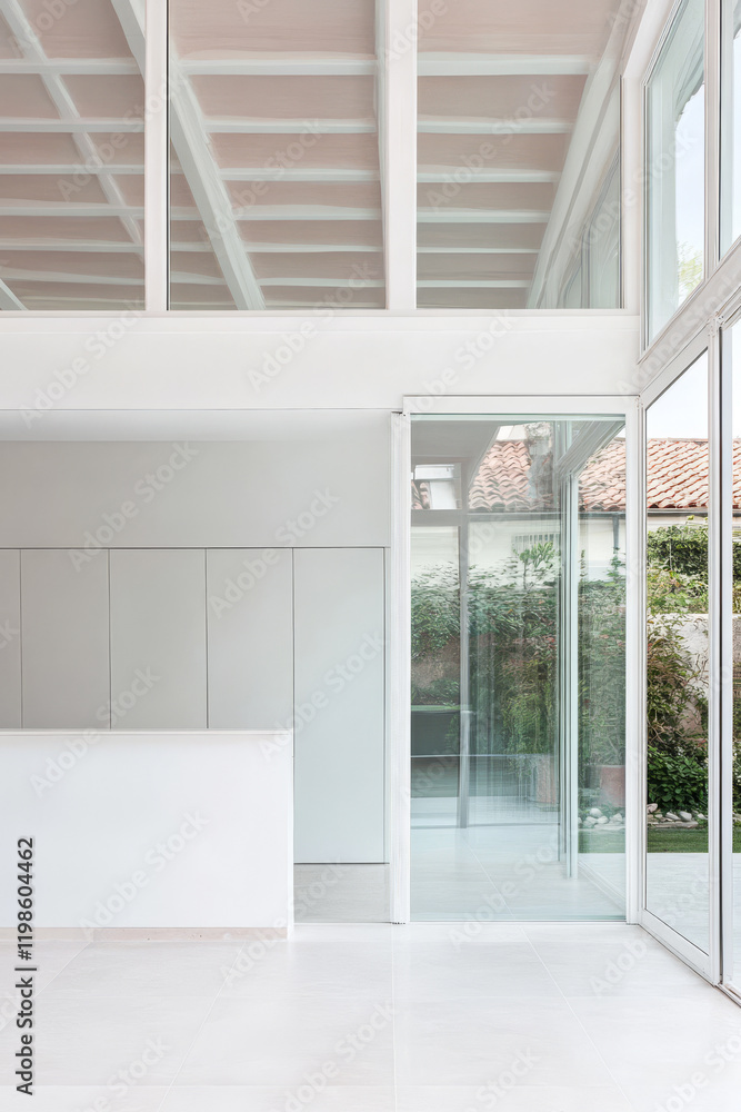 Modern minimalistic interior design with large glass windows and white accents Modern minimalistic interior design with large glass windows and white accents