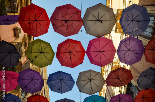 umbrellas hanging over a street
create an interesting background