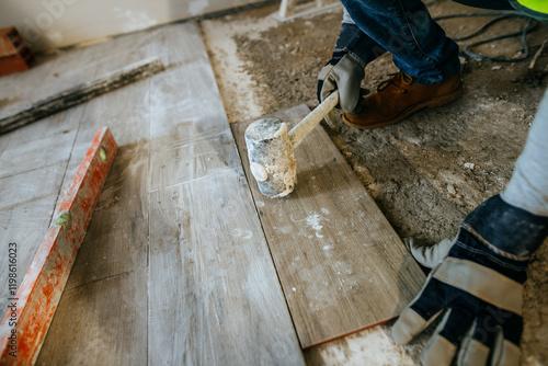 Wallpaper Mural Close-up of Worker laying flooring in construction site Torontodigital.ca