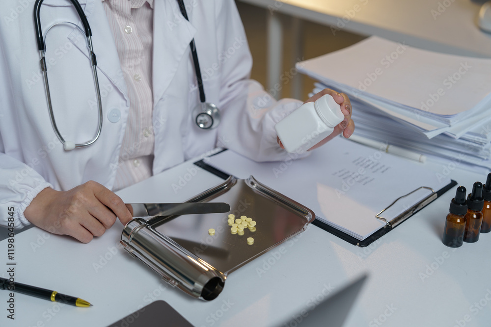 Doctor preparing medication while holding a pill container and utilizing a pill counting tray, surrounded by documents and various medicine bottles on the desk Doctor preparing medication while holding a pill container and utilizing a pill counting tray, surrounded by documents and various medicine bottles on the desk