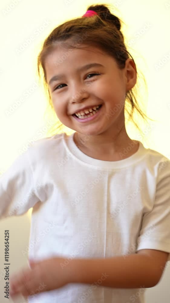 view of active awake little girl 5 years old having fun singing favorite song enjoying hobby in morning spending leisure time jumping in room. High quality 4k footage view of active awake little girl 5 years old having fun singing favorite song enjoying hobby in morning spending leisure time jumping in room. High quality 4k footage