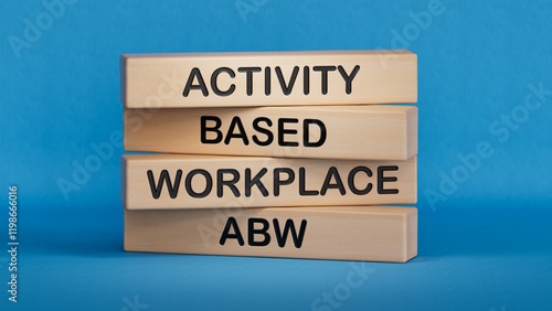 On a wood board, wooden word cubes are arranged in the letters ABW. It is an abbreviation for Activity Based Working.3D rendering on blue background. photo