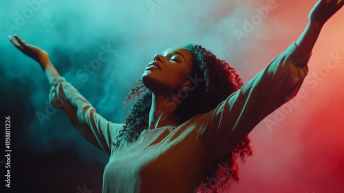 Young woman letting go of problems , and feeling free with arms in the air. Praise and worship concept.