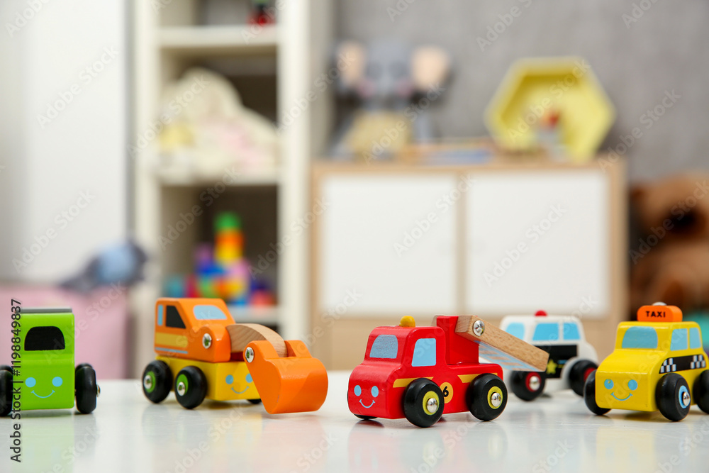 Many car toys on white table in kids room