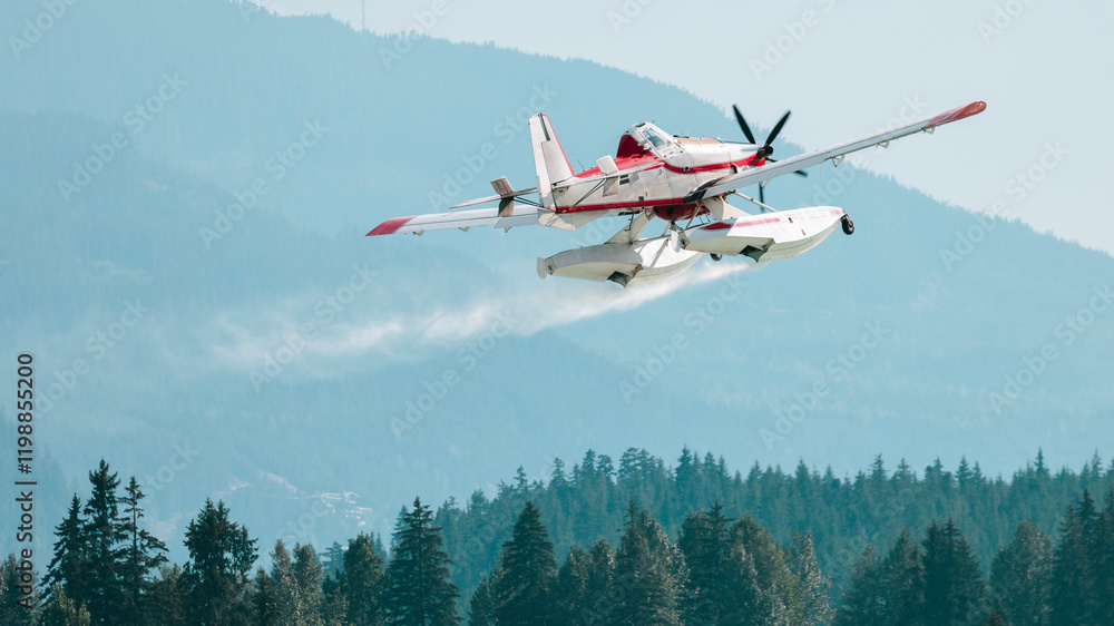 Aerial firefighting plane skims a lake to collect water Aerial firefighting plane skims a lake to collect water