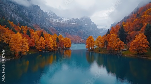 Wallpaper Mural A serene autumn landscape featuring vibrant orange trees and a tranquil lake surrounded by mountains. Torontodigital.ca
