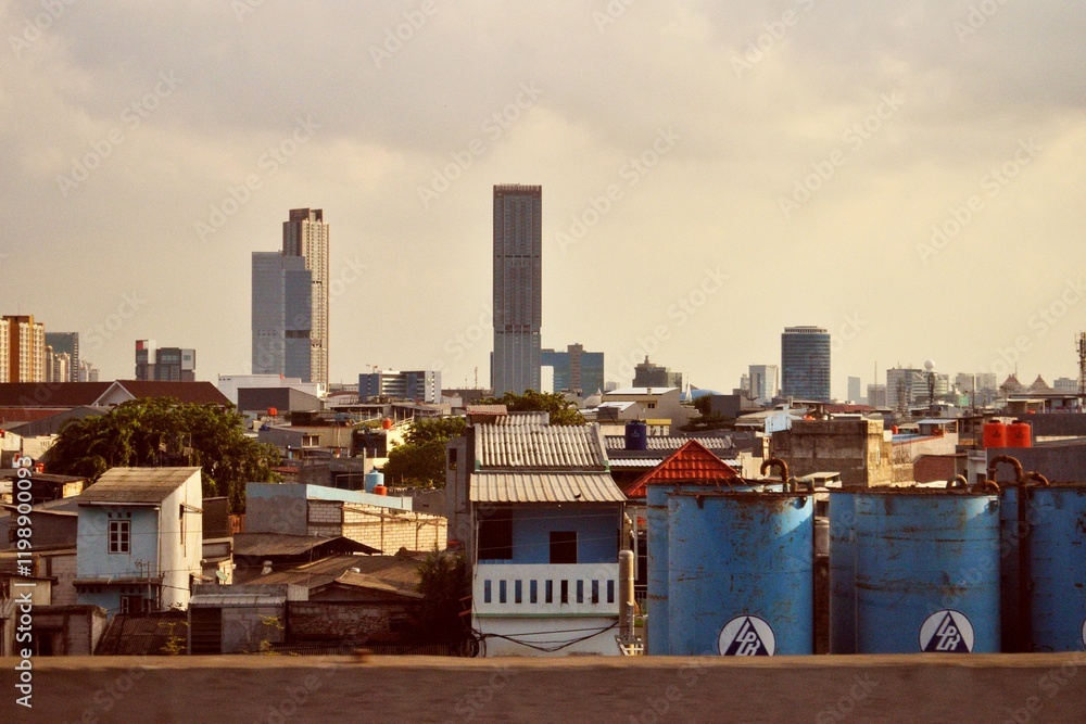 Houses and tall buildings in urban Jakarta Houses and tall buildings in urban Jakarta