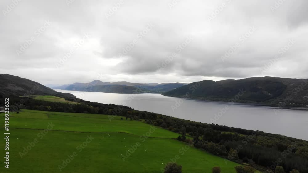 Aerial forward shot showing the length of Loch Ness with mountains in the distance on a calm day Aerial forward shot showing the length of Loch Ness with mountains in the distance on a calm day