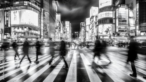 A bustling pedestrian crossing during rush hour, with blurred figures and a sense of motion and urgency, in black and white.