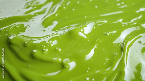 Close-up of vibrant green slime texture with smooth surface and space for text insertion. photo