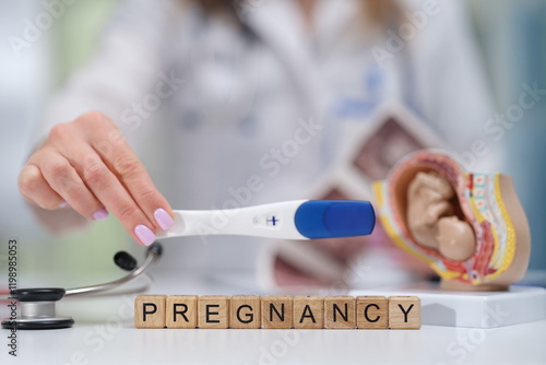 A pregnancy test that comes along with various medical tools illustrating important pregnancyrelated information