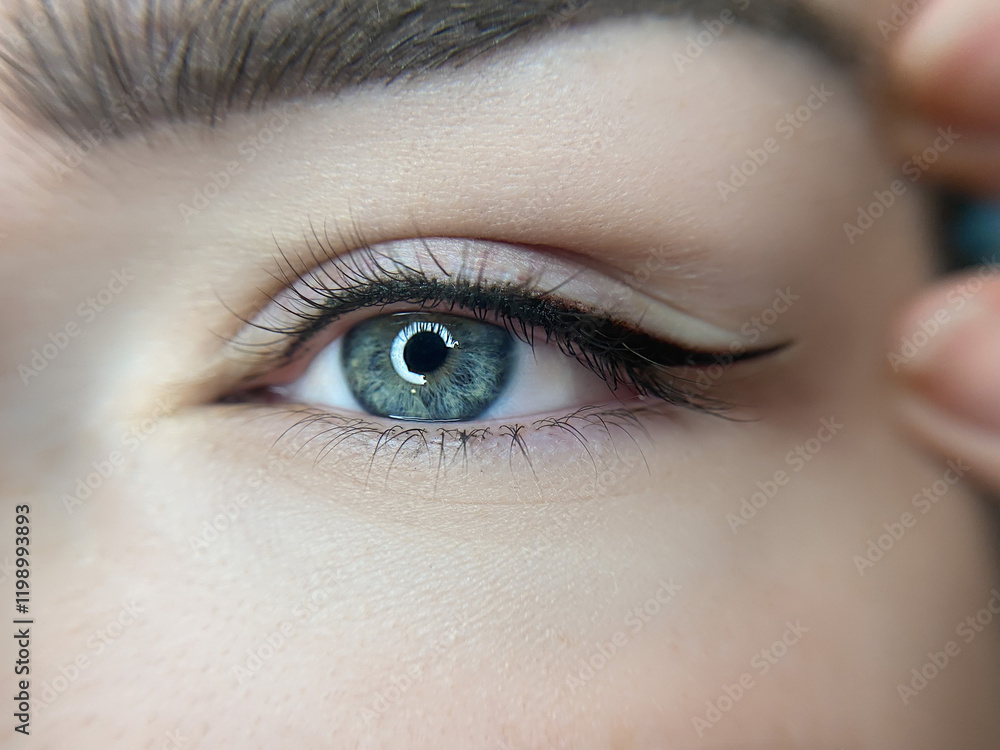 Obraz premium permanent eyeliner makeup close up. Healthy and clean skin young woman