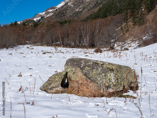 Teberda National Park. Shore of Lake Tumanly-Gel or Tumanly-Kol (Misty Lake) covered with snowdrifts. Gonachkhir River Valley. Dombay, Karachay-Cherkessia. photo