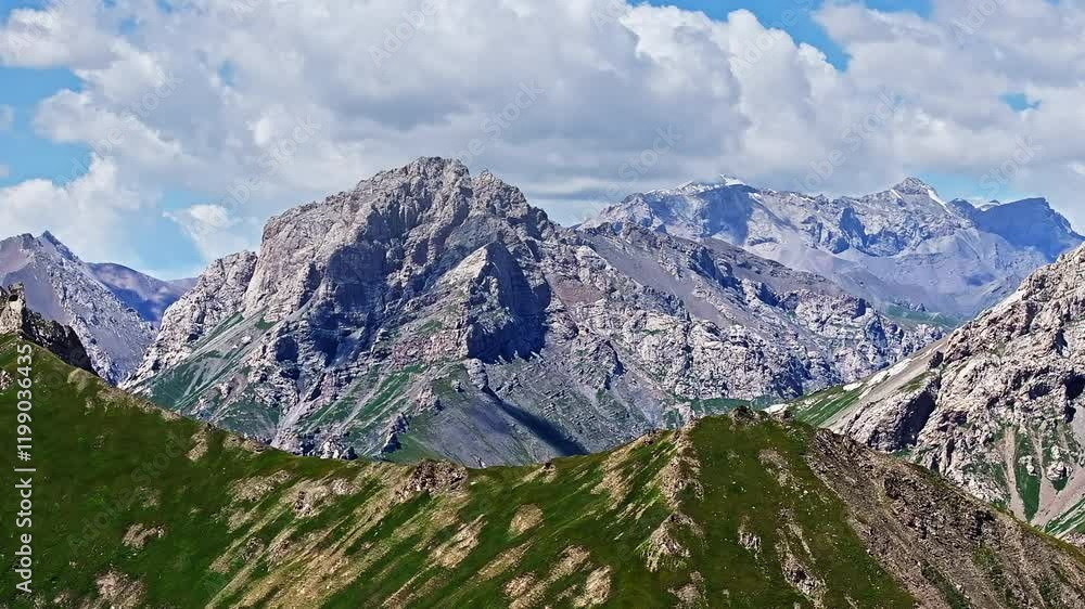 Layered mountain landscape with a cloudy sky Layered mountain landscape with a cloudy sky