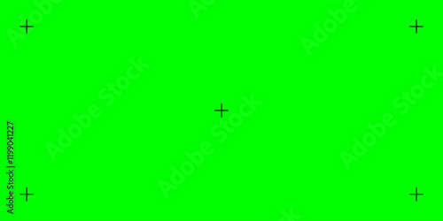 Green screen with black tracker marks for chromakey. Used in film and video projects to add visual effects. 
