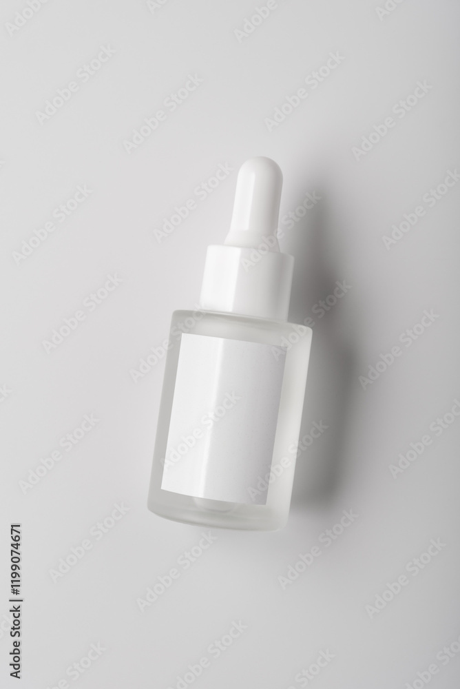 Minimalist glass dropper bottle with blank label for mock-up Minimalist glass dropper bottle with blank label for mock-up