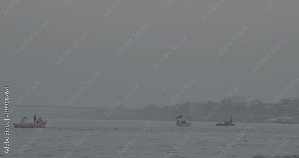 Varanasi, India. Ungraded C LOG 2 Tourists And Pilgrims Floating On Ganga River. Boat Ride On Ganges River. Purple Sunset Sky At Evening Time. Sacred Waters Of Ganges River. Every Day Life Of India Varanasi, India. Ungraded C LOG 2 Tourists And Pilgrims Floating On Ganga River. Boat Ride On Ganges River. Purple Sunset Sky At Evening Time. Sacred Waters Of Ganges River. Every Day Life Of India