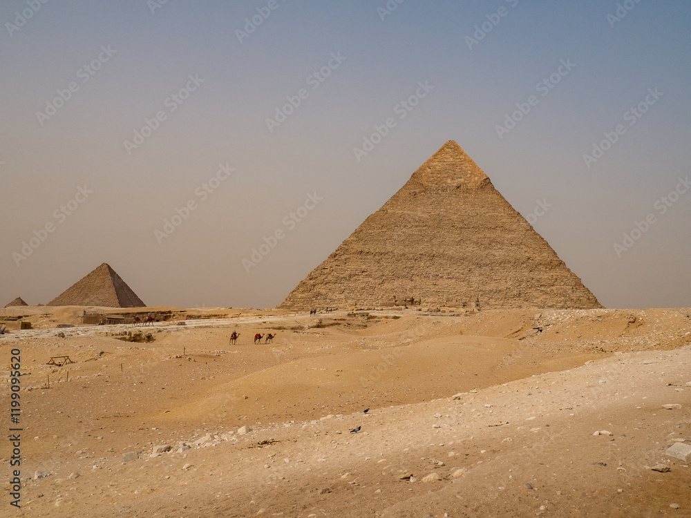 Famous Great Pyramids of Chephren and Cheops, Cairo, Egypt. Two of the three Great Pyramids, Giza pyramid complex (Giza Necropolis) Famous Great Pyramids of Chephren and Cheops, Cairo, Egypt. Two of the three Great Pyramids, Giza pyramid complex (Giza Necropolis)
