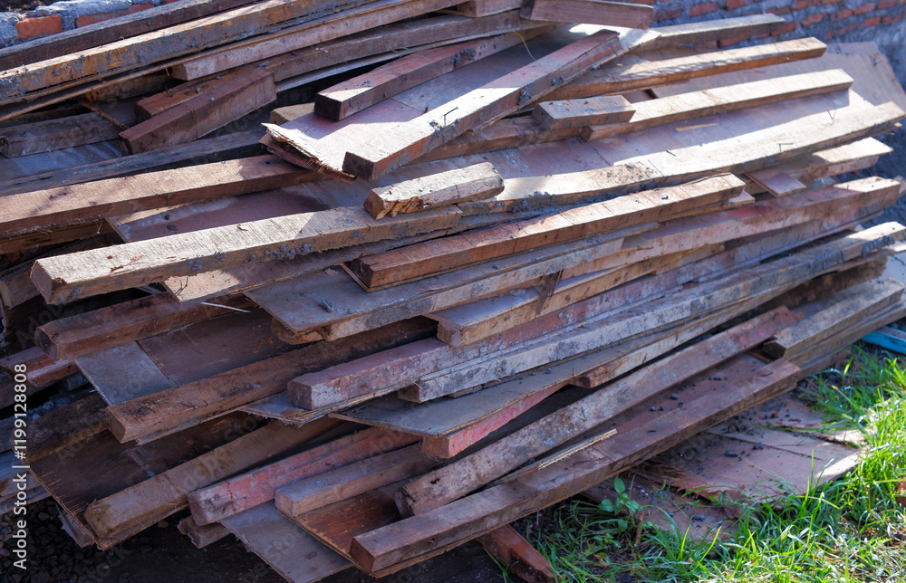 Dirty pile of scrap wood with cement and nails in construction area Dirty pile of scrap wood with cement and nails in construction area