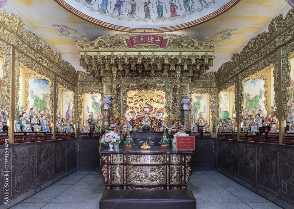 Caishen Chinese God of Prosperity or God of wealth goddess of fortune in front of Doumu Yuanjun statue inside the Buddhist temple of Wat Dhammakatanyu (Xian Lo Dai Tien Gong). The God traditional.