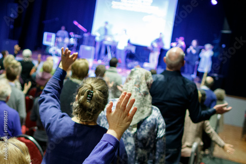 Evangelical church service with worshippers engaged in song and prayer in a vibrant community setting