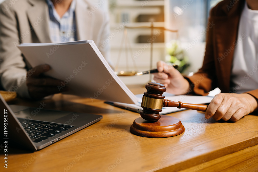 Teamwork of business lawyer meeting working hard about legal legislation in courtroom to help their customer Teamwork of business lawyer meeting working hard about legal legislation in courtroom to help their customer