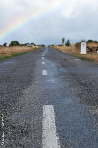 Obraz na płótnie Rainbow on a wet street in the Province of Leon on the Camino de Santiago w salonie
