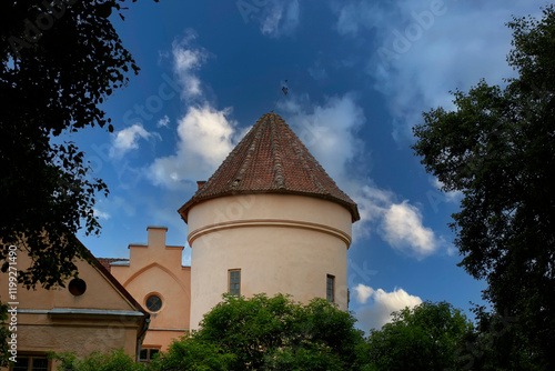 Castle tower with blue skies in the background. Medieval castle in Europe in summer.