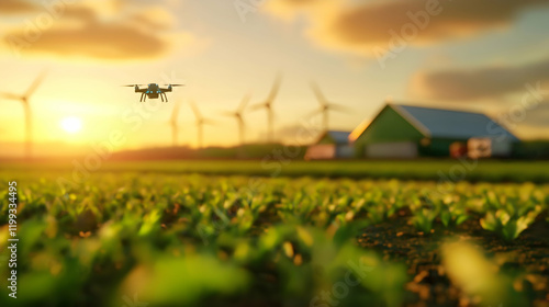 A drone hovers over a lush green field at sunset, with wind turbines and a barn in the background, illustrating modern farming techniques.