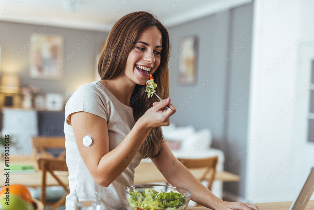 Woman Eating Salad While Wearing Health Tracker At Home Kitchen Woman Eating Salad While Wearing Health Tracker At Home Kitchen